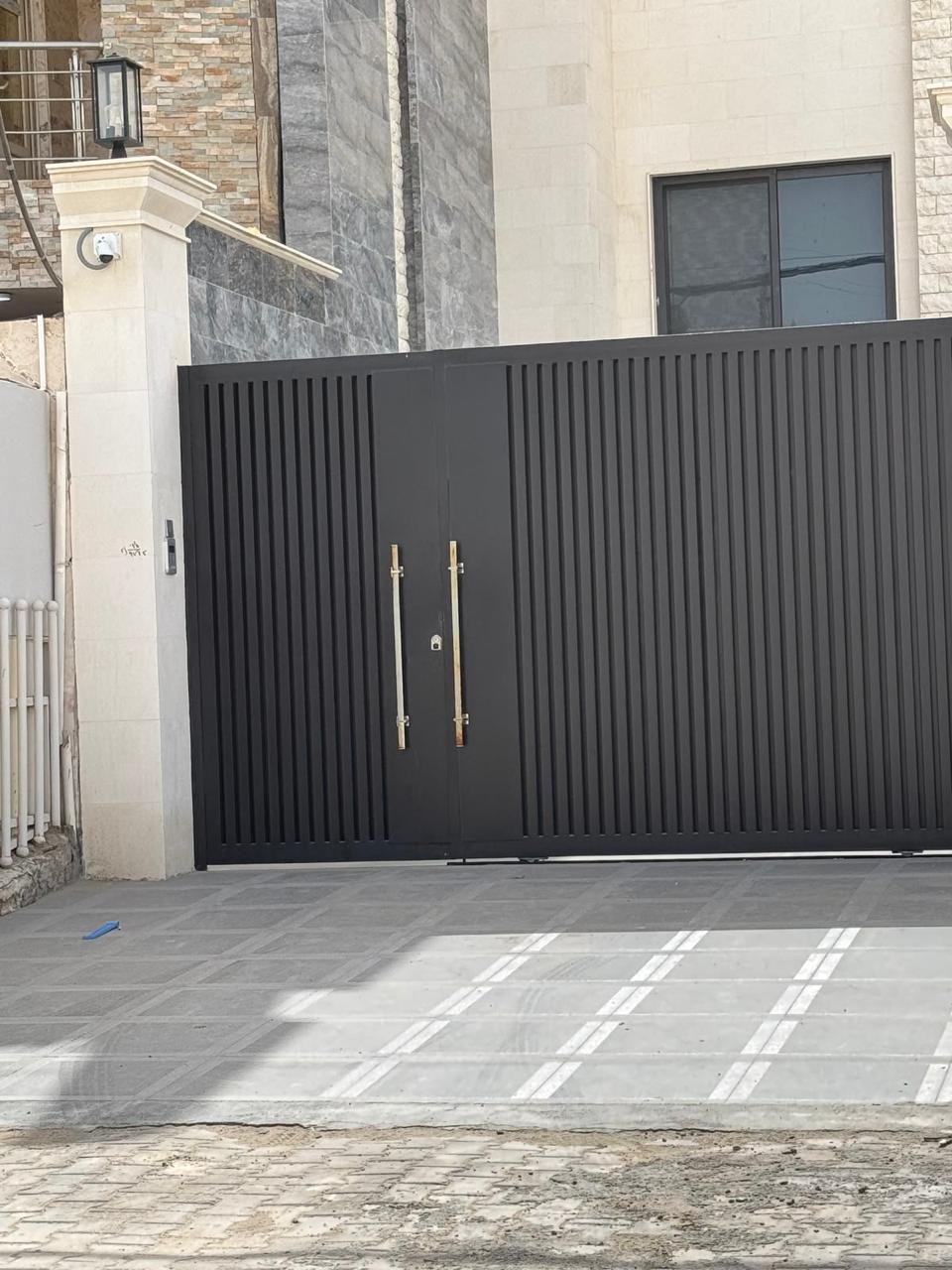 Completed black double-leaf swing gate