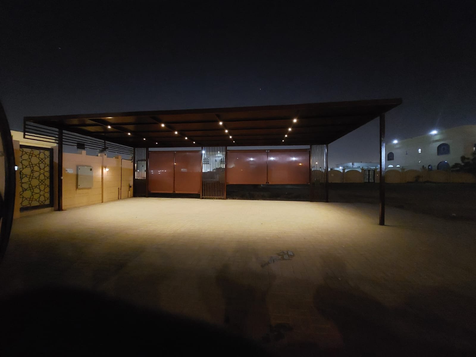 Completed large parking shade at night